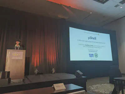 Anubhav Panda presenting μShell at OSDI 2026